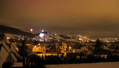 panoramic view of fireworks from the balcony in the valley below